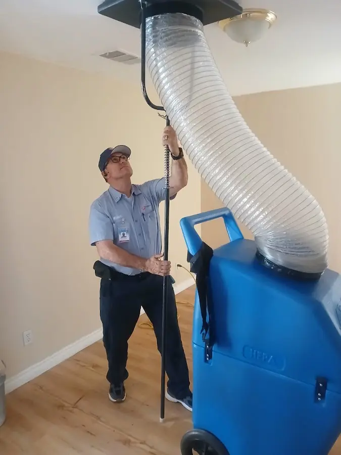 Furnace Tune-Up technician using HEPA equipment in Dahlonega